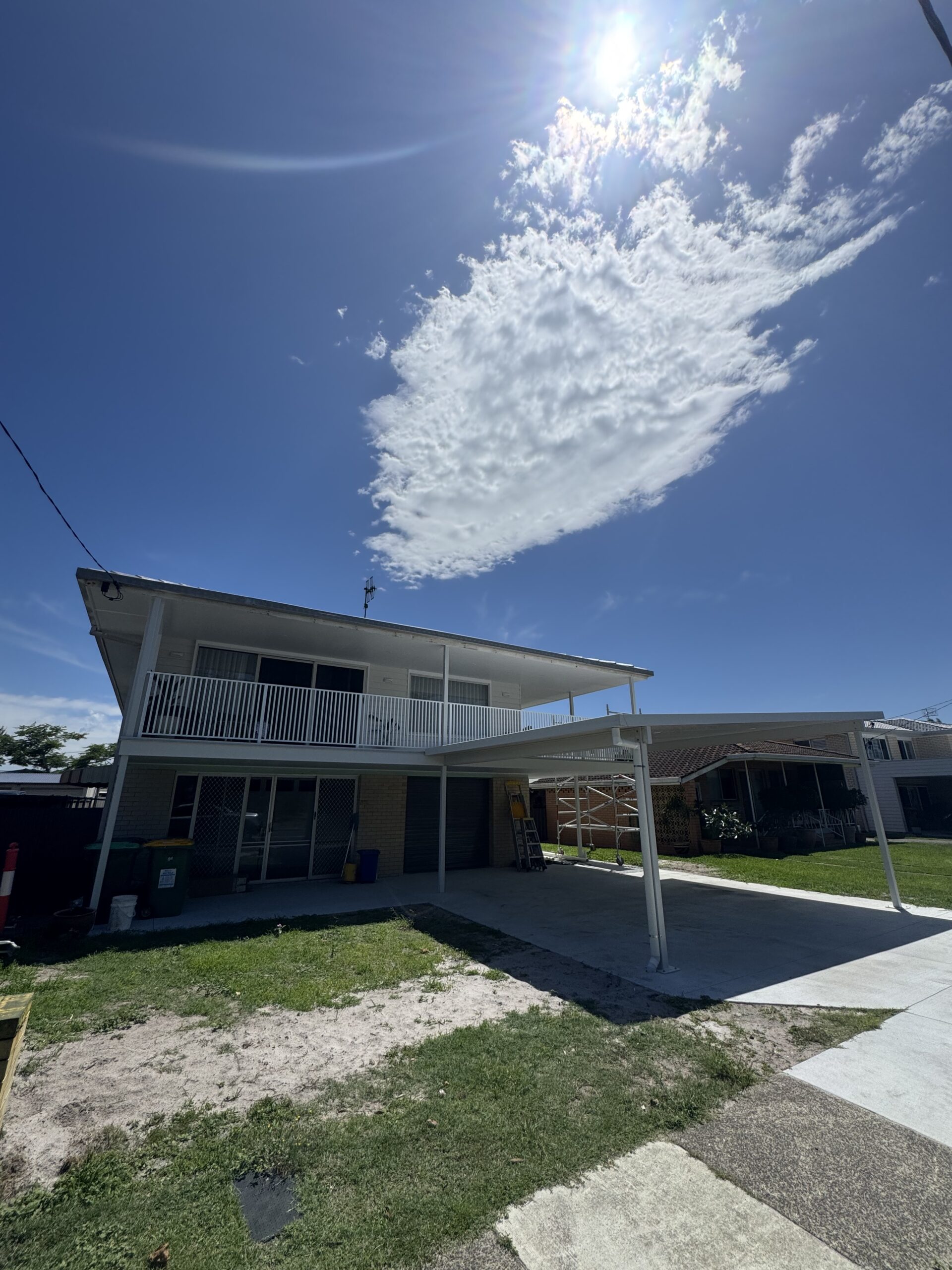 A completed two storey build with its own carport and upper balcony, of the kind used for dual occupancy