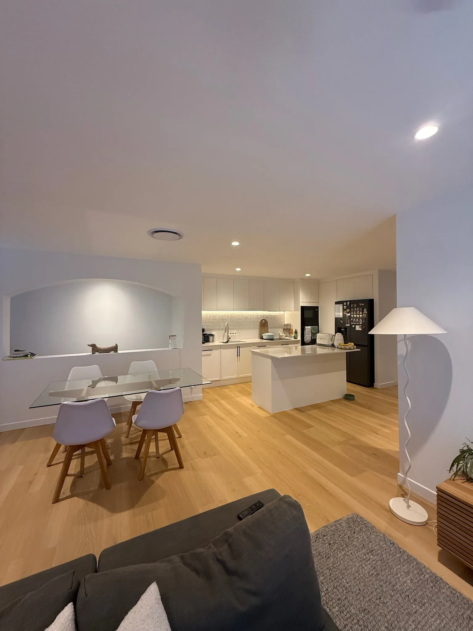A renovated open plan kitchen and dining space with timber floors